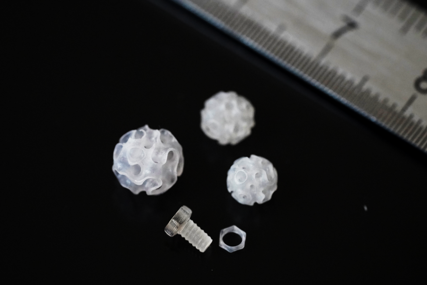 Printed structures using READYPCL INX including a functioning nut and bolt, printed on the Readily3D Tomolite v2.0